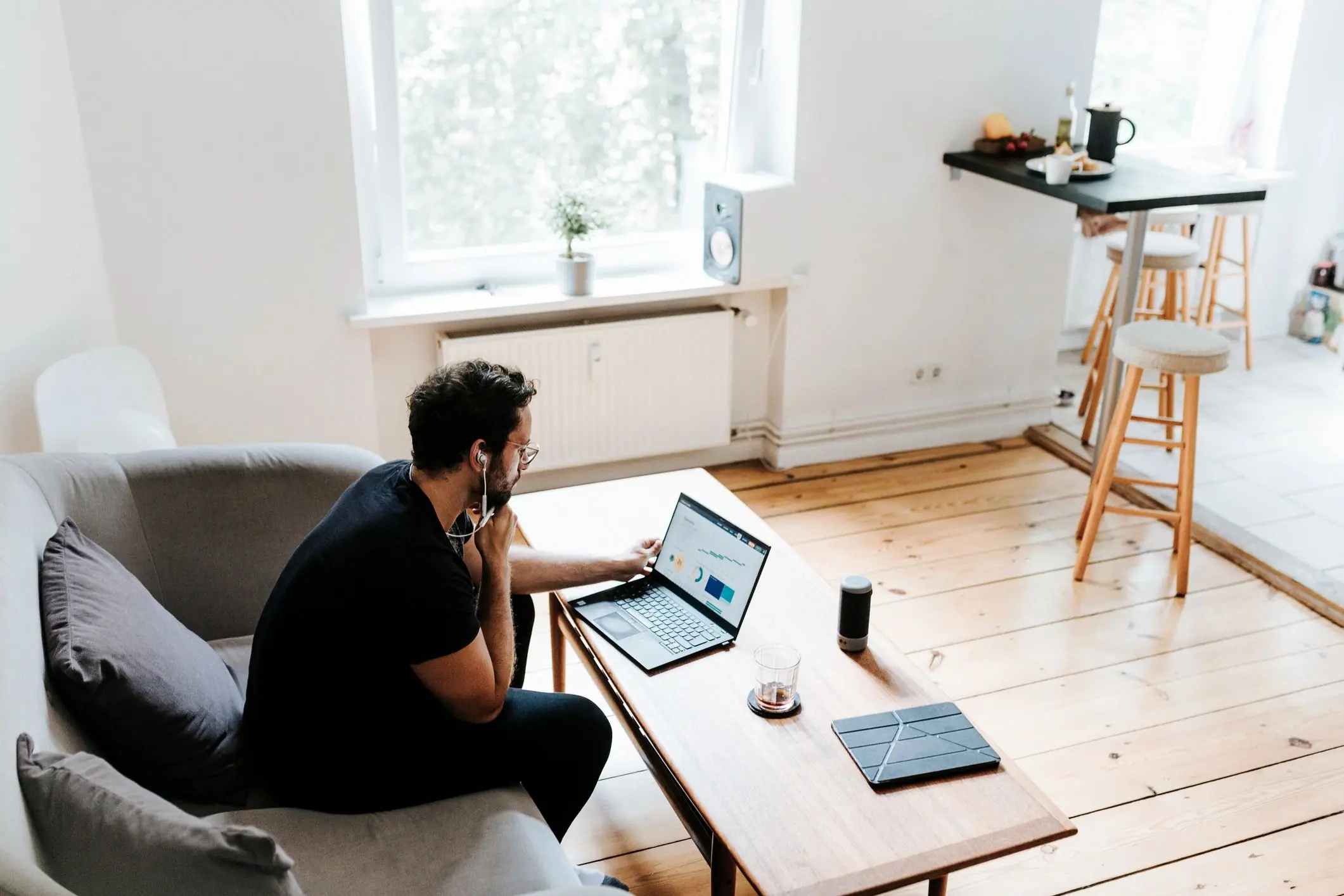 Man works with laptop in his living room