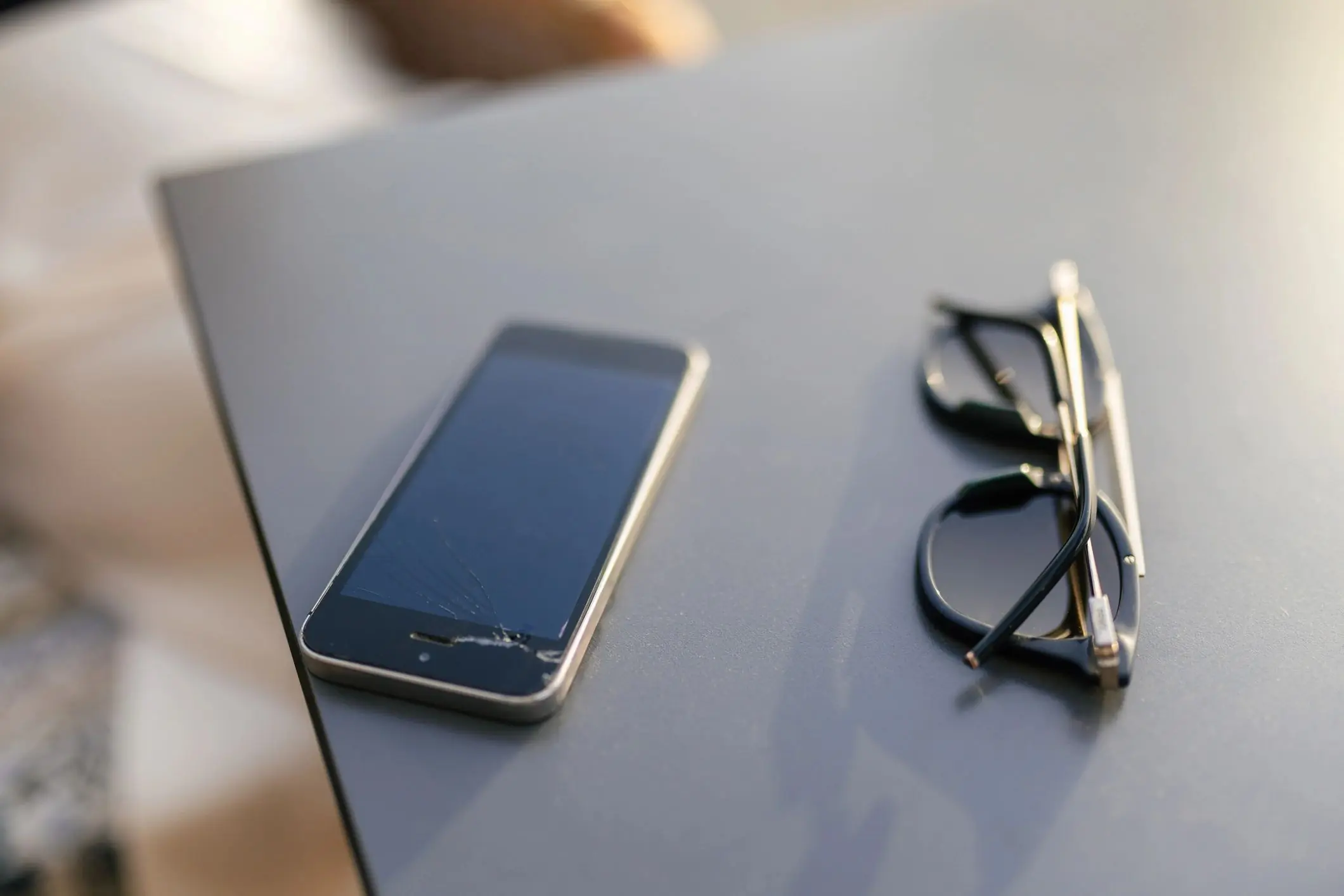 Close-up of a smartphone with a cracked screen