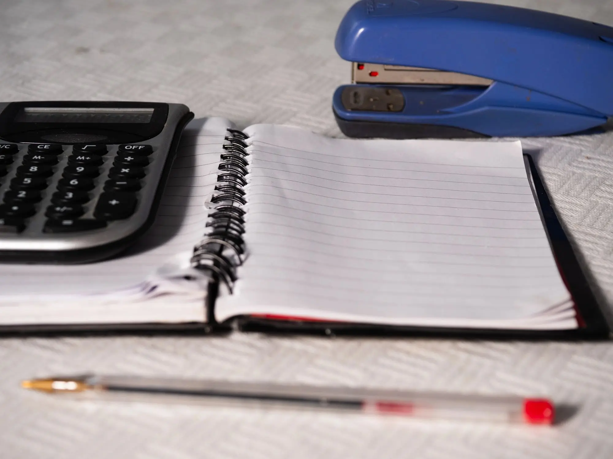 Notepad paper in office with loan calculator or mortgage calculators